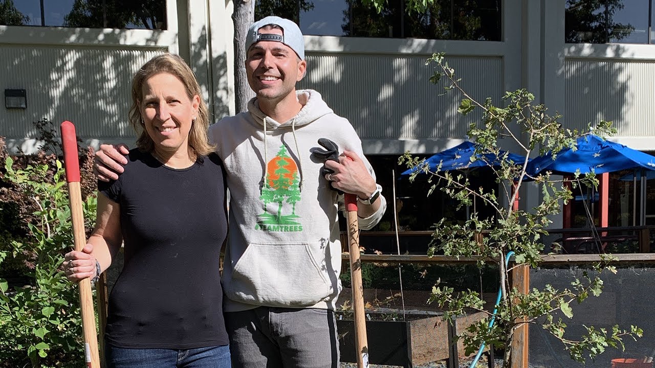 Mark Robber and Susan Wojcicki planting a tree